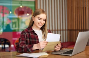woman opening mail