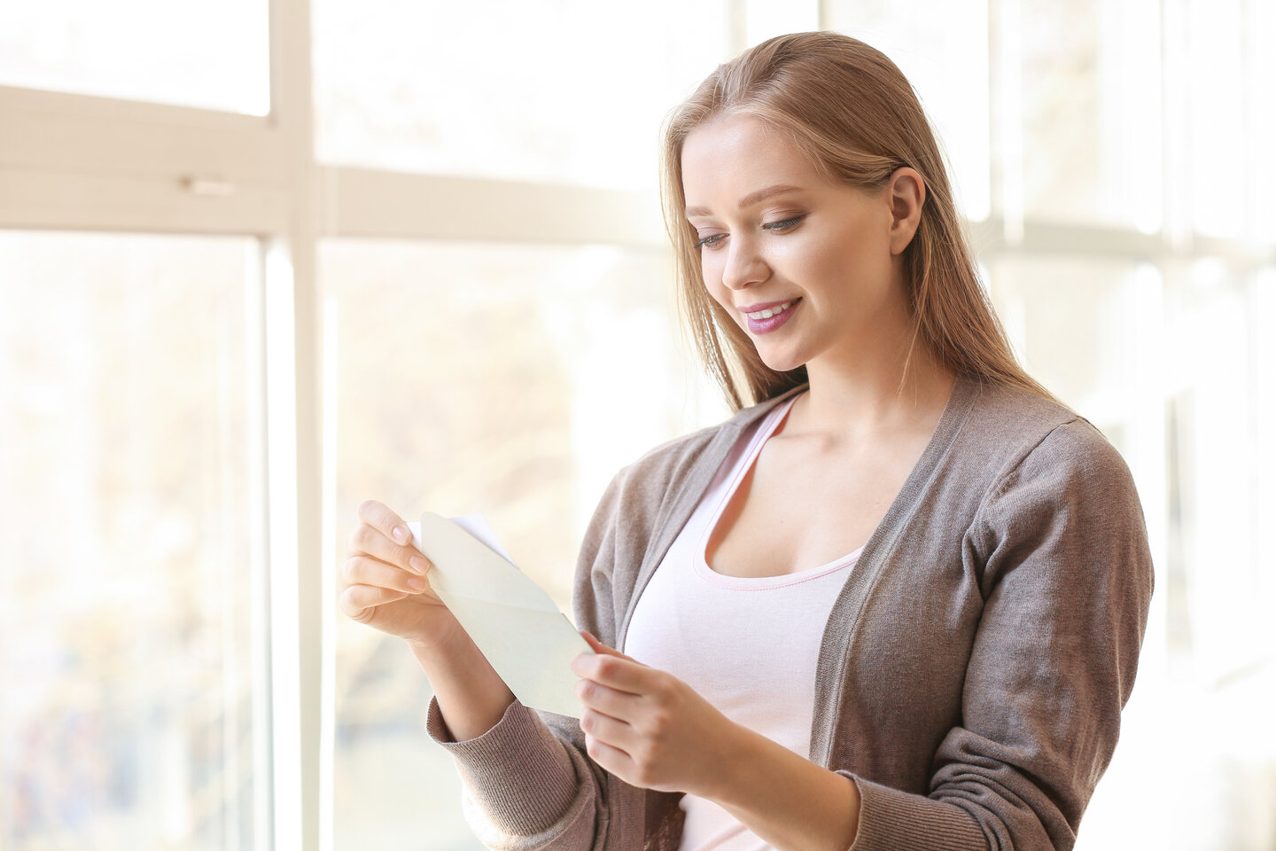 smiling-female-receives-mail.jpg